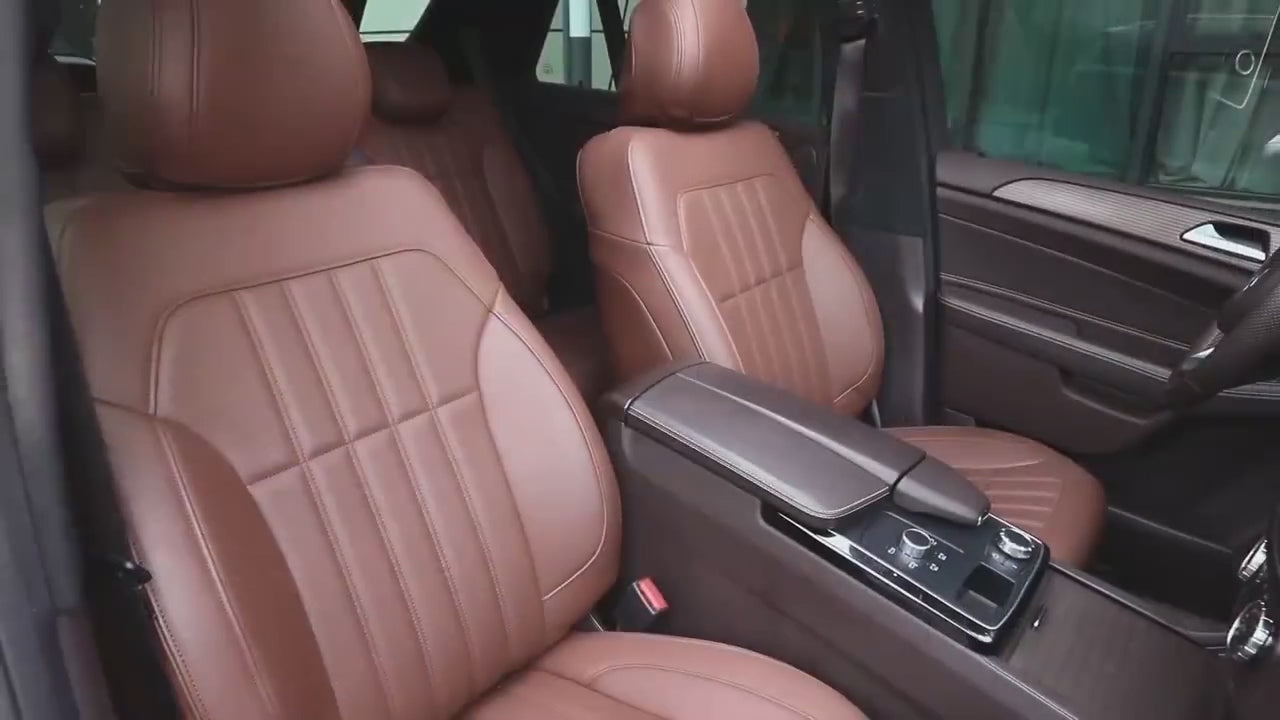 Load video: Car with brown seat covers.